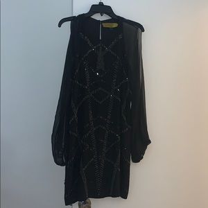 black Nicole Miller fancy dress meant for a party